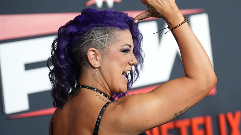 WWE star Bayley posing at a red carpet event