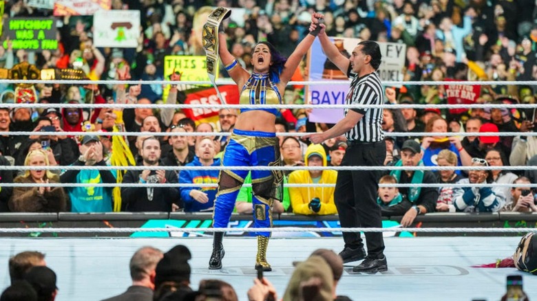 Bayley holds up the WWE Women's Championship after defeating IYO Sky at WrestleMania 40.