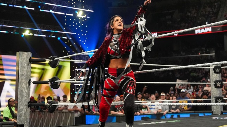 Bayley poses on the apron before a match on 