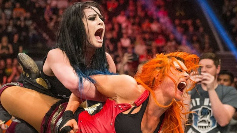 Becky Lynch grabbed by Saraya 