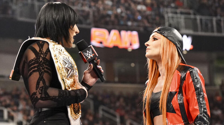 Rhea Ripley talking to Becky Lynch