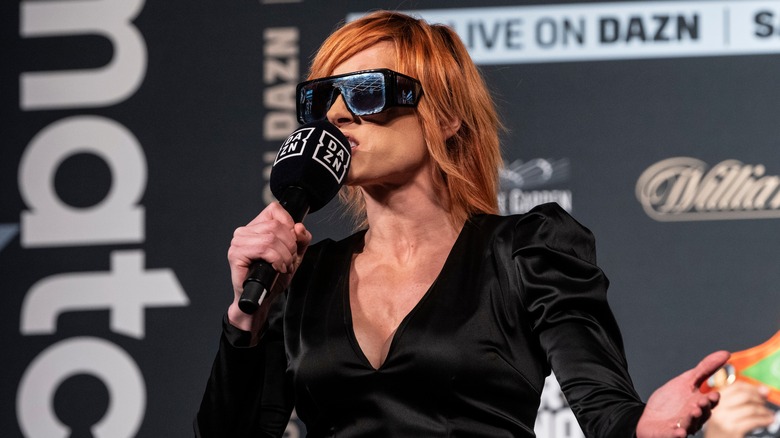 wwe becky lynch in sunglasses with microphone