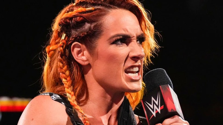 Becky Lynch talks into a microphone