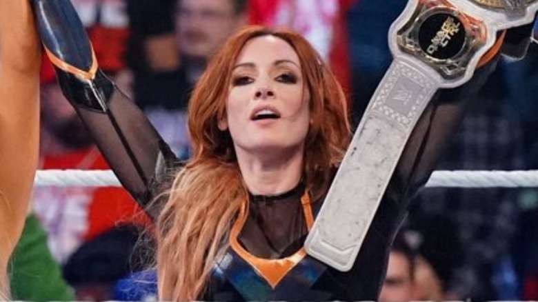 Becky Lynch celebrating her tag title win