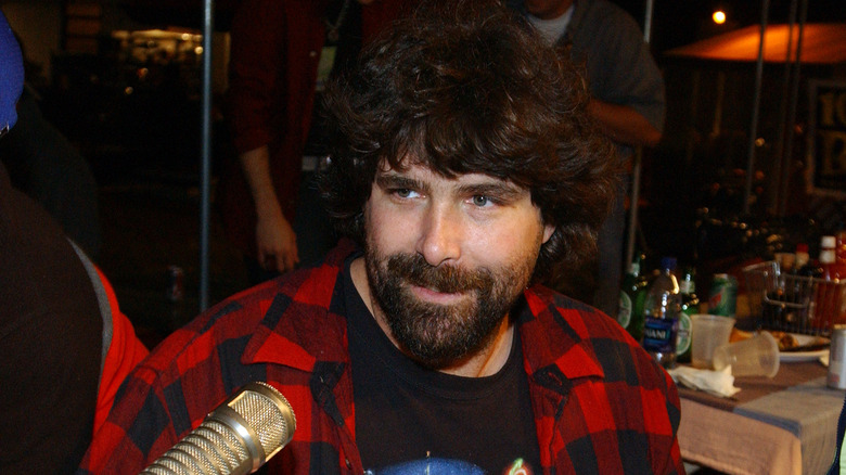 Mick Foley speaking into a mic