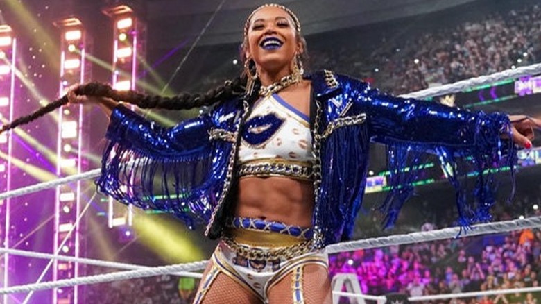 Bianca Belair poses on the apron