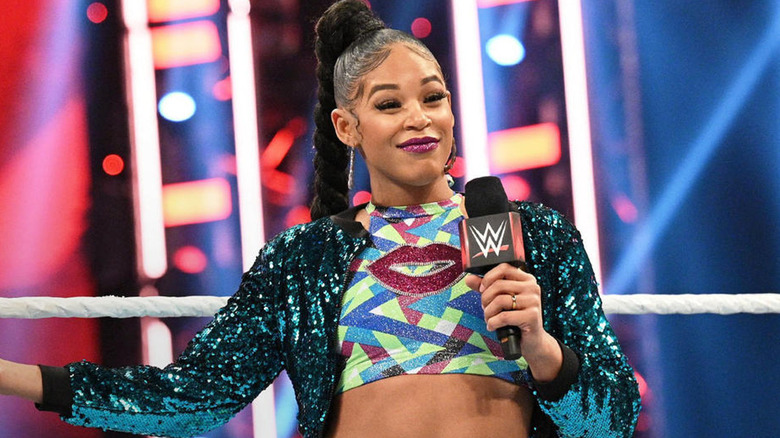 Bianca Belair smiling on the mic 