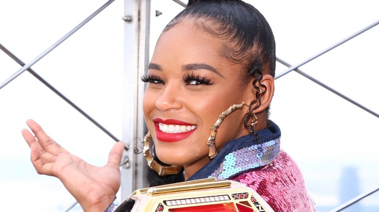 Bianca Belair smiling with her title