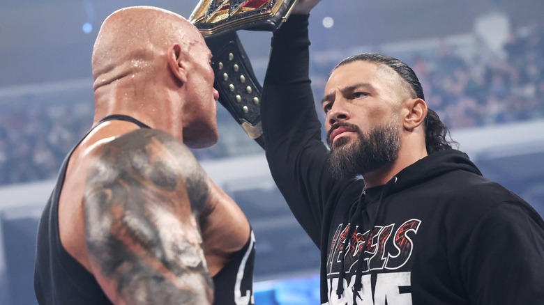 The Rock faces down Roman Reigns