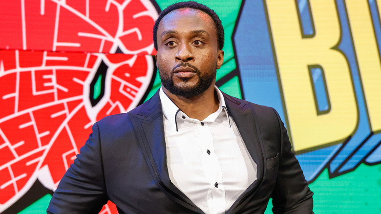 Big E wearing a suit