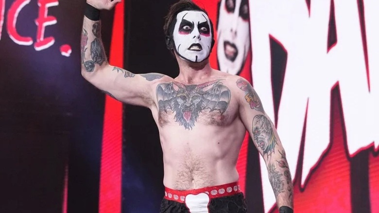 Danhausen poses on the stage before heading down the ring for a match on AEW programming.