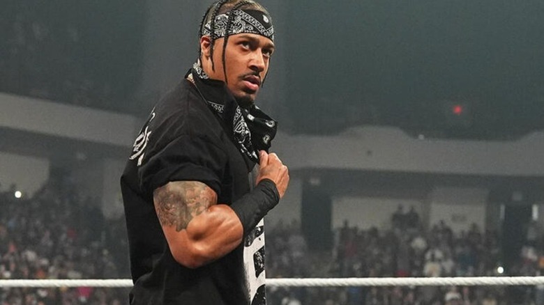 Carmelo Hayes pulls down the bandana around his face to reveal himself as the newest member of 946 on an episode of "WWE Raw."