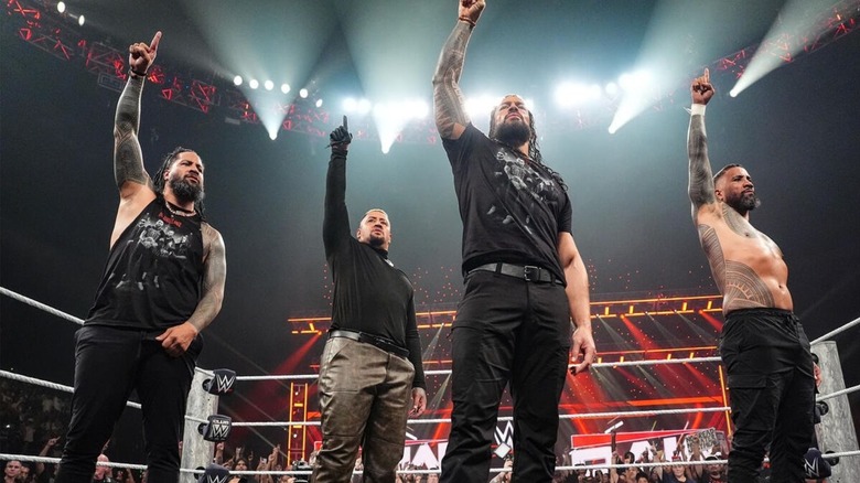Jimmy Uso, Solo Sikoa, and Jey Uso stand alongside Roman Reigns, with their "ones up" after the Bloodline ran off the 946 in the final segment of the October 19, 2026 edition of "WWE Raw."
