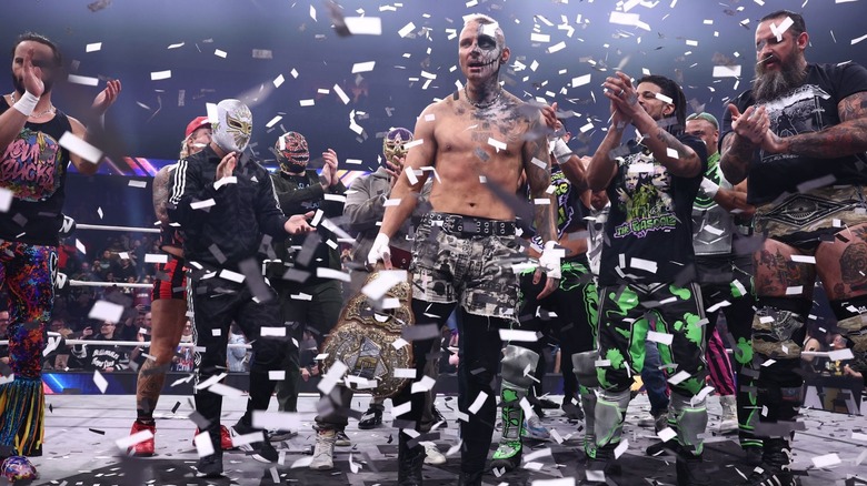 Darby Allin standing amidst confetti and the AEW locker room on "Dynamite"