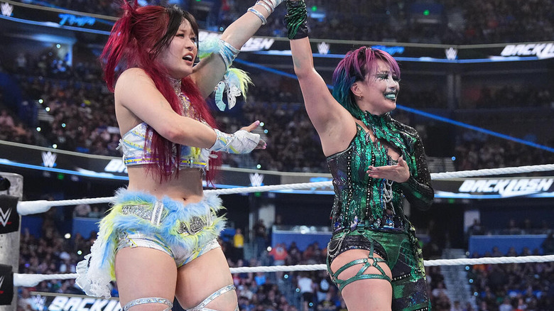 IYO SKY and Asuka celebrate together after their match at WWE Backlash