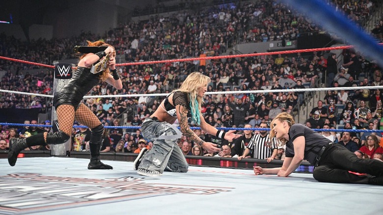 Becky Lynch attacks Sol Ruca from behind as Ruca checks on referee Jessika Carrat WWE Saturday Night's Main Event