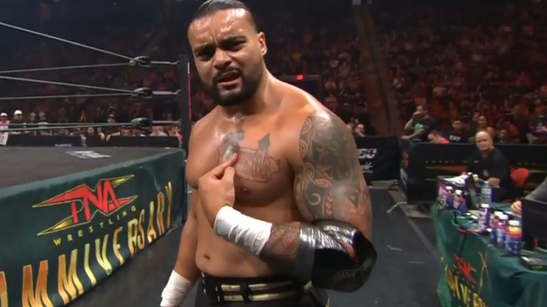 Mike Santana on the outside of the ring