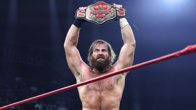 Mark Davis holds up the AEW National Championship in the ring during the July 11, 2026 edition of "AEW Collision."