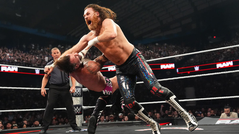 Sami Zayn clotheslines CM Punk on "WWE Raw"