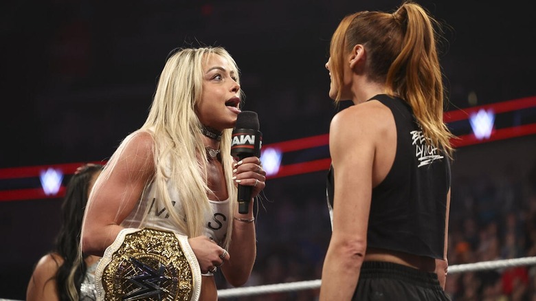 Liv Morgan faces off with Becky Lynch while speaking into a microphone on "WWE Raw"