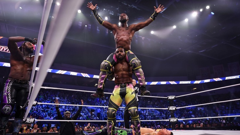 Kofi sits on Austin Creed's shoulders while Swerve Strickland looks on on "AEW Dynamite"