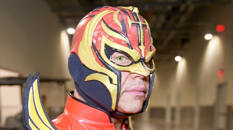 Rey Mysterio looks over shoulder