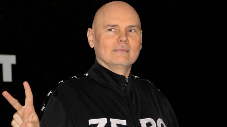 Billy Corgan flashes the peace sign