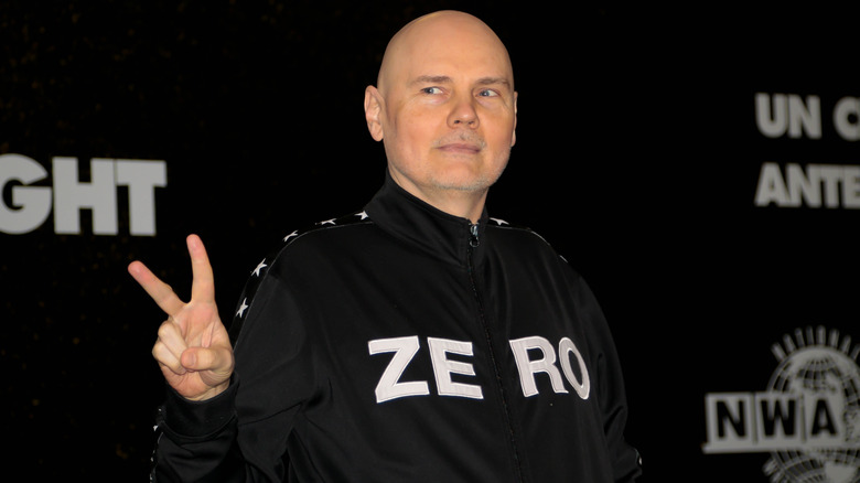 Billy Corgan flashes the peace sign