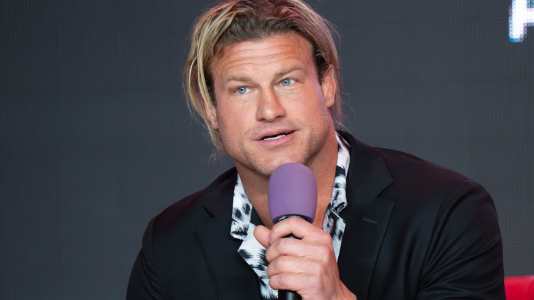 Nic Nemeth is holding a microphone