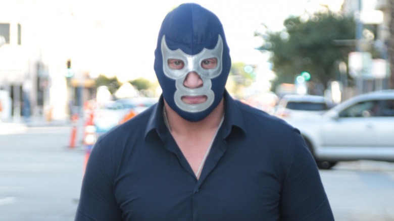 Blue Demon Jr. walking down the street