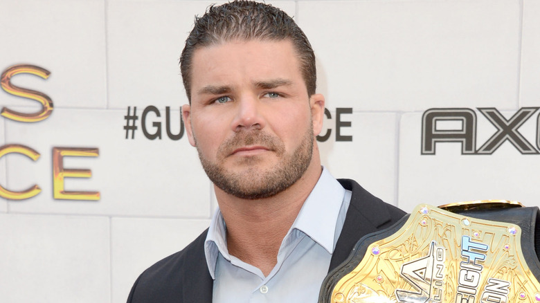 Bobby Roode holding a championship belt
