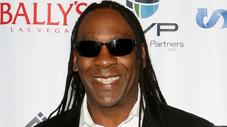 Booker T smiling in glasses