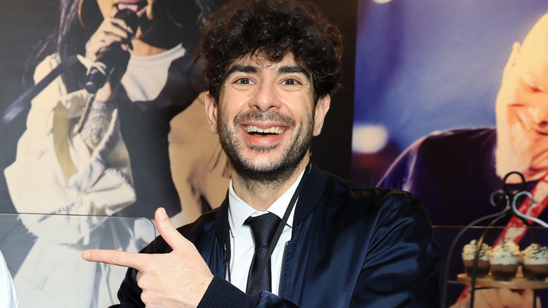 Tony Khan smiling and pointing