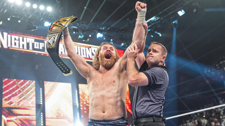 Sami Zayn celebrating his world title win