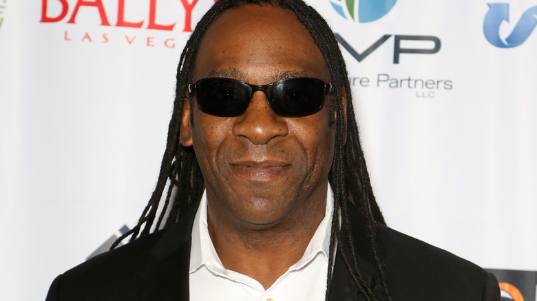 Booker T with sunglasses on and smiling