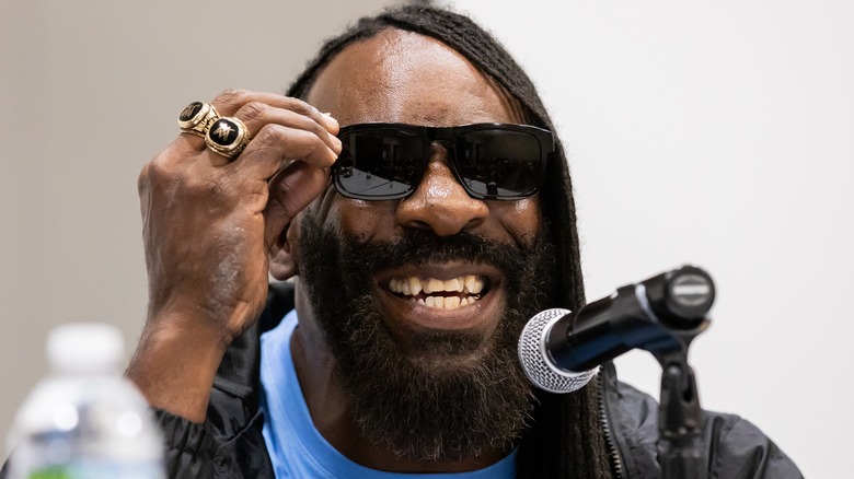 Booker T smiling in glasses