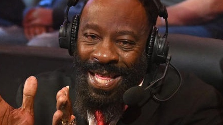 Booker T talking during an episode of WWE television while on commentary.