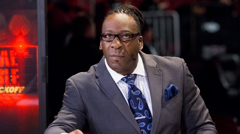 Booker T sitting at commentary during the WWE Royal Rumble Kickoff pre-show broadcast.