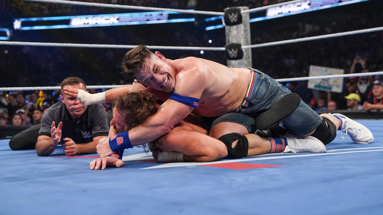 John Cena locks in an STF on Sami Zayn