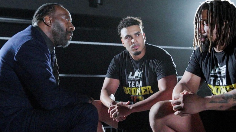 Two-time WWE Hall of Famer Booker T listens to "LFG" students Jasper Troy and Kam Hendrix