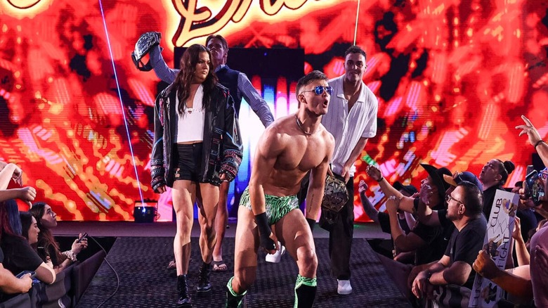 The Vanity Project, Myka Lockwood, NXT Tag Team Champions Brad Baylor and Ricky Smokes, and Jackson Drake, head down the ramp to the ring before a match at 