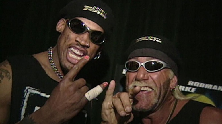 Dennis Rodman and Hulk Hogan posing backstage with the 