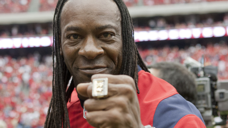 Booker T smiling with his WWE HoF ring