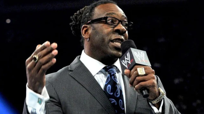 Booker T holding a microphone