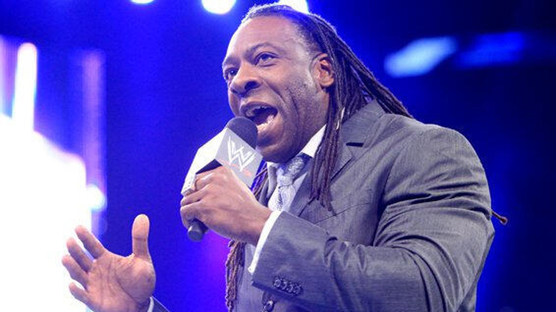 Booker T speaking on the microphone in WWE