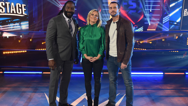 Booker T, Renee Young, and CM Punk