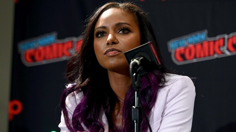 Brandi Rhodes sits at the microphone