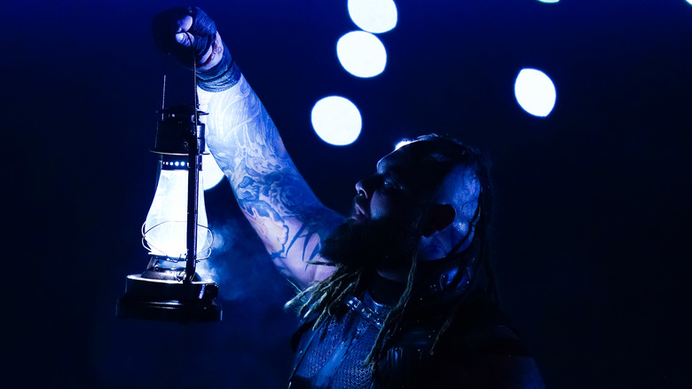 Bray Wyatt holds lamp