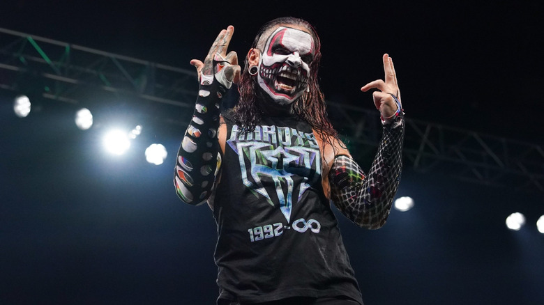 Jeff Hardy hits his signature pose on the turnbuckle during a TNA taping, wearing face paint that looks like The Fiend.