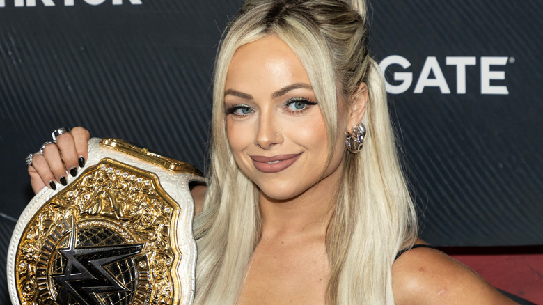 Liv Morgan holding the WWE Women's World Championship